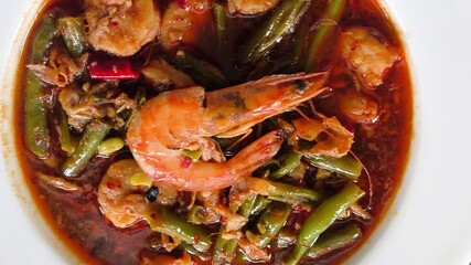 Wall Mural - Fried shrimps with long beans and rice in plate, outdoor Chiangmai Thailand.