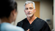 © SJ Studio - Surgery eyelid rejuvenation concept. A healthcare professional converses with a patient, showcasing a supportive and informative interaction in a clinical setting.