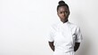 © Александра Ходорковс - Serious african female chef in uniform against white background