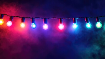 Wall Mural - String of colorful lights on dark background