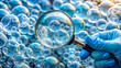© GraphicsKB - Close-Up of Gloved Hand Holding Magnifying Glass Over Soap Bubbles