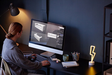Leinwandbilder - Person working on computer, designing modern furniture pieces with 3D software. Room includes a desk lamp, small plants, and a lightning-shaped light creating cozy atmosphere