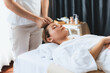 © InfiniteFlow - Caucasian woman enjoying relaxing anti-stress head massage and pampering facial beauty skin recreation leisure in dayspa modern light ambient at luxury resort or hotel spa salon. Quiescent
