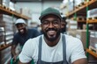 © c80 - A friendly warehouse employee wearing a cap and apron, photographed in a warehouse atmosphere, illustrating teamwork and a welcoming workplace vibe.