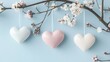 © Simon - Hanging pastel hearts on cherry blossom branches, spring decoration, pastel blue background, minimalistic floral scene