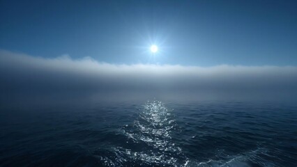a tranquil view of the ocean with a clear blue sky
