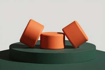 Poster - Three orange cylindrical objects arranged on a green circular platform against a light background
