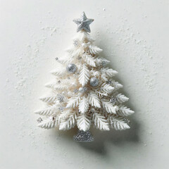 Wall Mural - A small, white Christmas tree with silver accents and a star on top