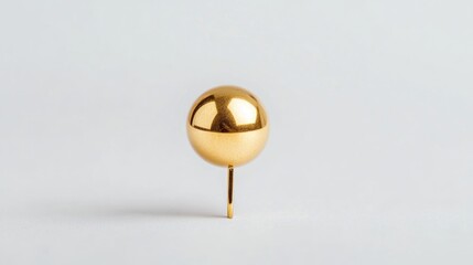 Poster - A single gold ball is placed at the top of a wooden stick on a white surface