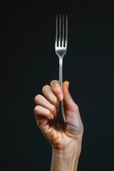 Aufkleber - A person grasping a fork with intent, possibly at a meal or table setting