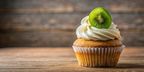 Poster - A Single Cupcake Topped With Whipped Cream and a Slice of Fresh Green Kiwi on a Rustic Wooden Surface