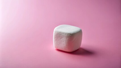 Poster - A single marshmallow sits on a soft pink background, bathed in a gentle light. The marshmallow appears fluffy, inviting, and ready for roasting.