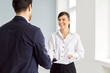 © Studio Romantic - Professional happy smiling woman realtor agent standing in empty new apartments with signed contract shaking hands making deal with man customer and new homeowner. Real estate market concept.