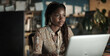 © FATNA - Black woman, laptop and global communication in office, email client and online to update website. Female person, journalist and chat to contact for quote in workplace, news and reporter for article