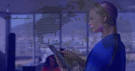 Poster - Image of globe and data processing over caucasian businesswoman using tablet in office