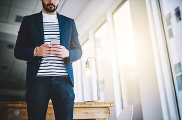 Aufkleber - Phone, hands and business man in office, typing email or text on app in creative startup. Mobile, worker and chat online for communication, ads or media strategist check campaign progress for promo