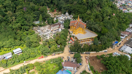 Wall Mural - Aerial view of Wat Tham Pha Jom temple in Mae Sai district of Chiang Rai province, Thailand. This temple is located on a hill near the Thailand and Myanmar Border.