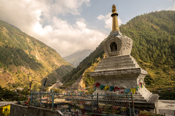 Wall Mural - Tibetan Buddhist pagoda in Syabrubesi village a beautiful resident village inside the Langtang National Park of Nepal. 