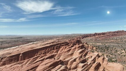 shimmering orb uap appears in the distance while flying over a southern utah desert landscape, appro