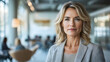 © Nuttamon - Businesswoman Leading Team Meeting in Modern Office for Empowerment and Growth