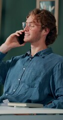 Poster - Man, smile and phone call in office for business, online consultation and friendly hello. Designer, glasses and tech in creative agency for communication, project feedback and contact for networking