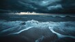 © Studio - Dark stormy clouds dominate the cold grey sky, creating a dramatic backdrop at sunset, with ocean waves below providing a captivating scene, enhanced by ample copy space for text.