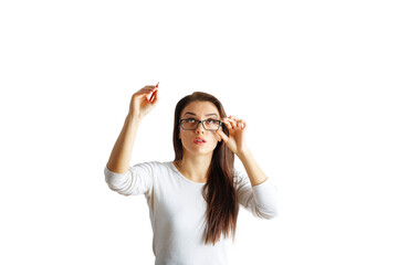 Poster - Portrait of a young woman adjusting her glasses and holding a pen, wearing a white shirt, on an isolated white background, concept of thinking