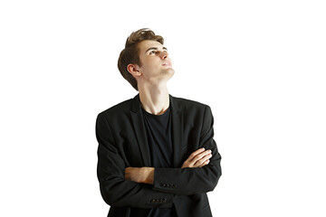 Poster - A young man wearing ablazer and shirt, arms crossed, looking up on an isolated white background. Concept of fashion or confidence