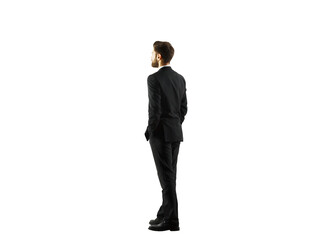Poster - Businessman standing in a suit facing sideways, isolated on a white background. Professional attire and posture, concept of corporate style