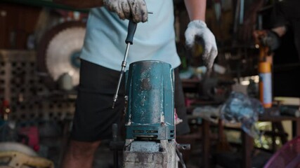 Wall Mural - Mechanical man working repair electric motor fix in house DIY working