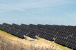 © Manu Prats - Solar panels on sloped terrain for eco-friendly energy innovation
