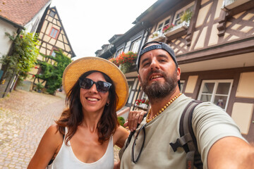 Selfie of a couple in the medieval village in the old town of Gengenbach in the Black Forest, Germany, family vacation concept