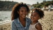 © claudunia - Smiling young black mother and daughter at the seaside.