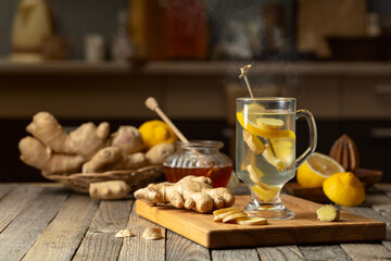 Poster - Ginger tea with lemon and honey on an old wooden table.