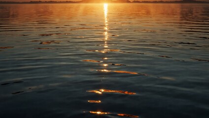 Wall Mural - Warm rays of sunset reflecting on the water’s surface.