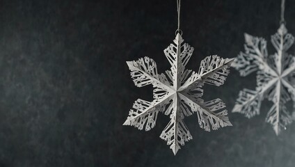 Wall Mural - White paper snowflake suspended from a string.