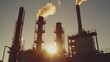 © NurNazira - Industrial Plant with Smoke Stacks at Sunset