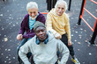 © Marko Geber - Senior men socializing and relaxing at outdoor park fitness area
