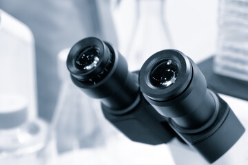 Poster - Two microscope eyepieces close-up in a laboratory