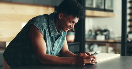 Poster - Online, man and happy with phone in kitchen for text message, reading email and positive feedback. Smile, person and typing on smartphone in home for internet research, checking notifications or chat