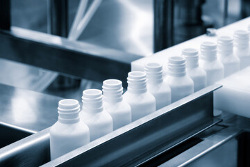 Poster - White plastic bottles for medicines and vaccines in a pharmaceutical factory