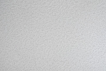Poster - A white wall with a textured surface. The wall is covered in a pattern of small bumps white gray texture background for template, page or web banner