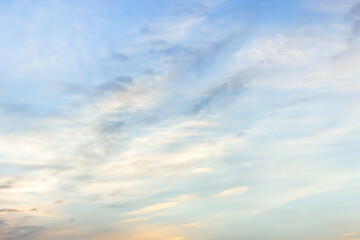 Wall Mural - a beautiful sky tinted by the sun leaving vibrant shades of gold, pink, blue and multicolored. cloud