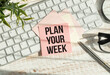 © Pawel - Word PLAN YOUR WEEK on paper with keyboard and pen on wooden background