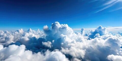 Wall Mural - aerial view of fluffy white clouds in a clear blue sky , clouds, aerial, sky, fluffy, white, nature,