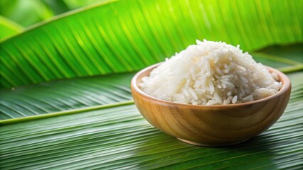 Wall Mural - Close up of freshly cooked rice with a background of vibrant green leaves, rice, fresh, cooked, food, grains