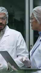 Poster - Two scientist in professional uniform working in curative laboratory for chemical and biomedical experiment