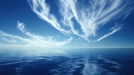 Wall Mural - blue sky with wispy clouds casting reflections on a calm ocean surface, peaceful and quiet