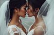 © Саша Федюк - Two beautiful Asian brides kissing each other, wearing white wedding dresses and veils, romantic wedding atmosphere