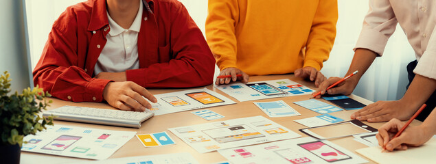 Poster - panorama banner of startup company employee planning on user interface prototype for mobile applicat